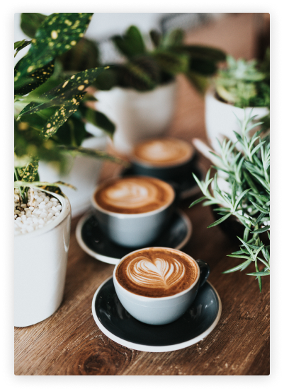 Another different shot of Two beautifully shot coffee mugs with coffee in them